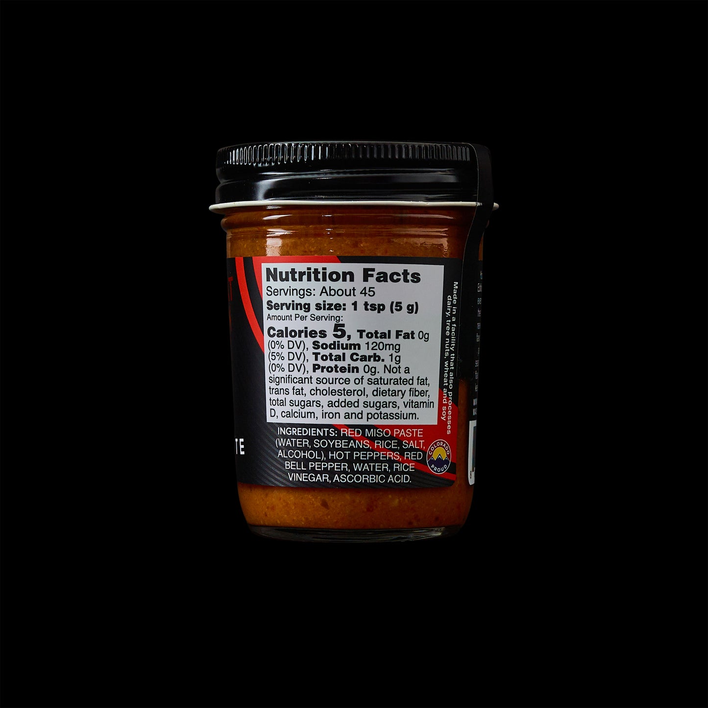 MisoHeat Chili Paste 8oz jar back view, with the nutrition label and a black background