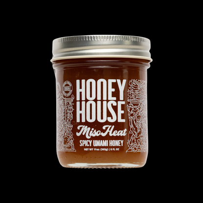 Jar of Honey House Miso Heat Spicy Umami Honey on a black background
